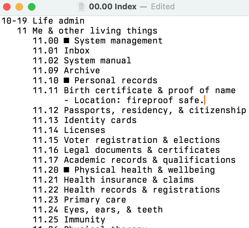 Screenshot of a text file. The first line is our area '10-19 Life admin'. Below that, indented, is '11 Me & other living things'. And below that, indented again, are our IDs, one per row.