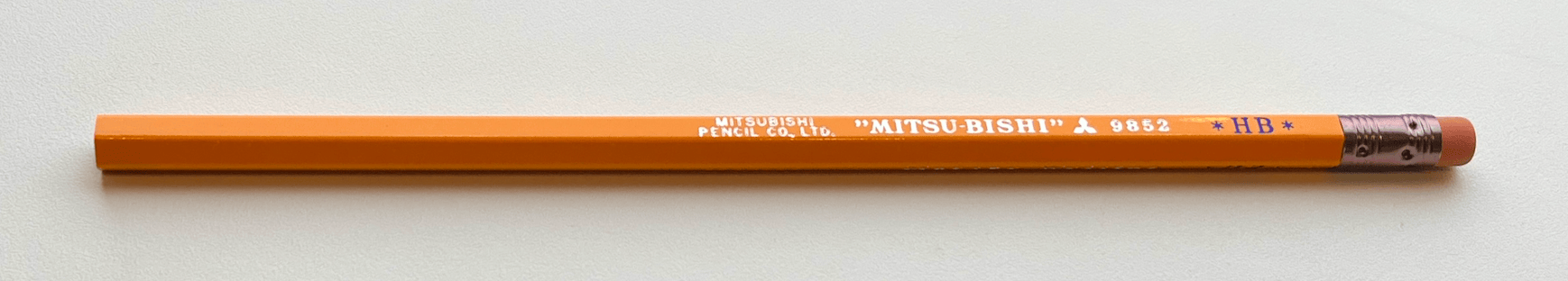 An orangey-yellow pencil. Brand new.