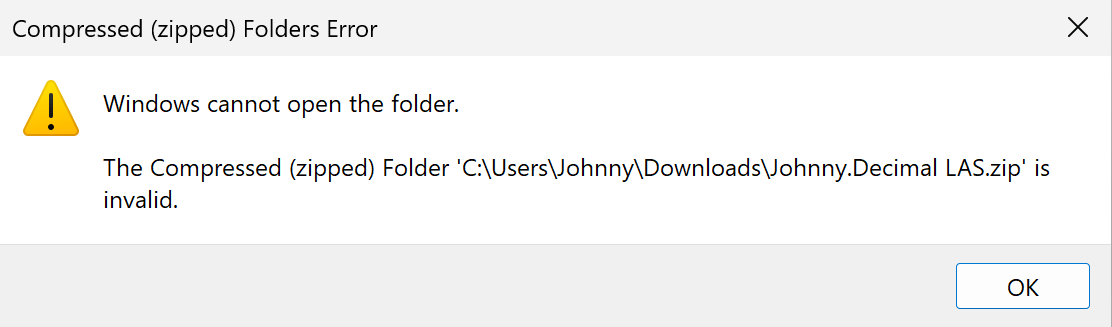A screenshot of this Windows error. The Compressed (zipped) folder 'C:\Users\<you>\Downloads\Johnny.Decimal LAS.zip' is invalid.